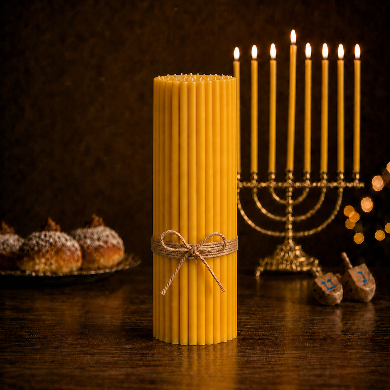 Closterra set of 90 tall natural beeswax Hanukkah candles beside a menorah
