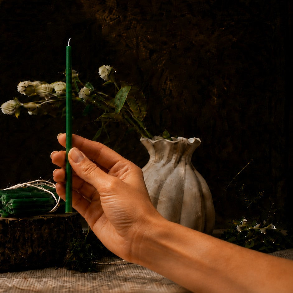 Green thin beeswax taper candle held in hand, 7.3 inch, Closterra