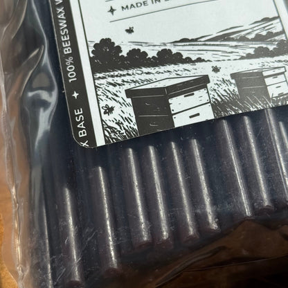 Black beeswax taper candles 6.5″, packaging label closeup