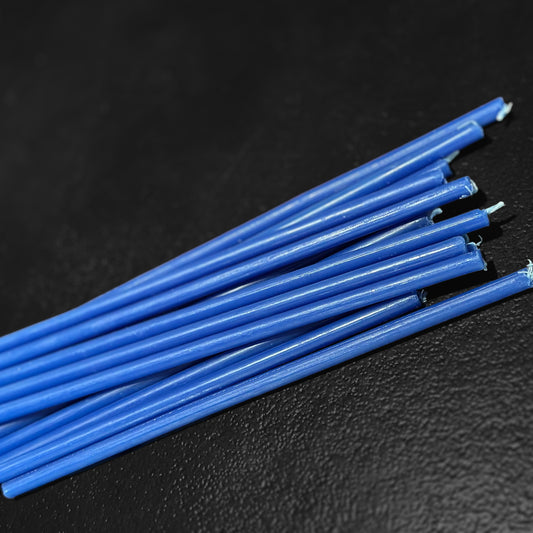 Blue beeswax taper candles 7.3″, closeup wicks on dark