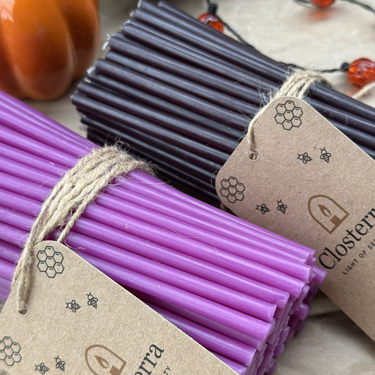 Black and purple beeswax taper candles 6.3″, bundles of 100 with Closterra tags