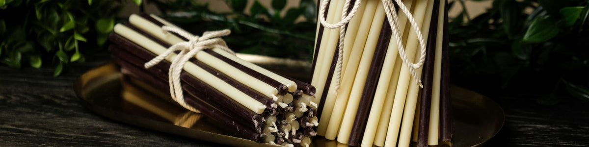 Bundles of Closterra beeswax taper candles