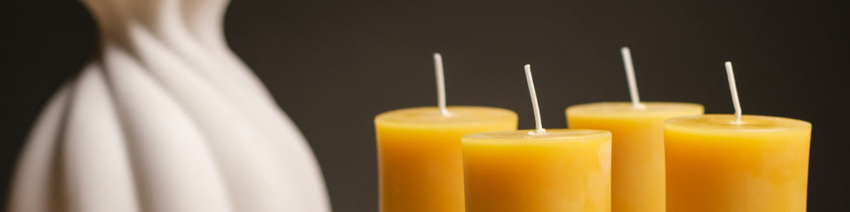 Closterra beeswax candles on a dark background