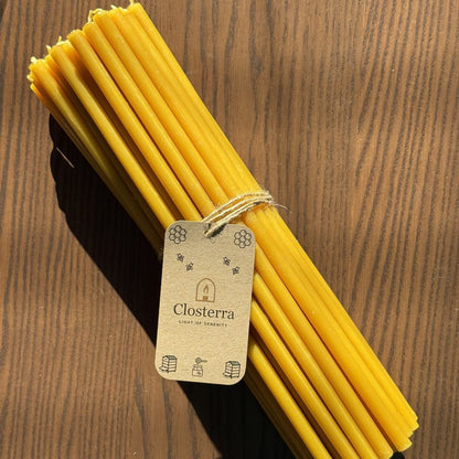 Natural beeswax Hanukkah candles, set of 45 tied with Closterra tag on wood