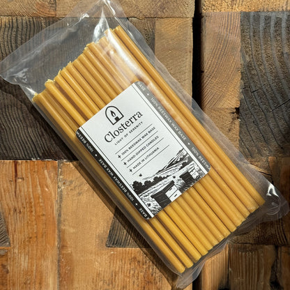 Natural yellow beeswax taper candles 8″, pack of 50 in Closterra packaging