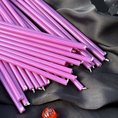 Purple beeswax taper candles 6.5″, loose tapers on black satin