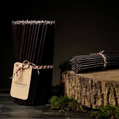 Closterra thin black beeswax taper candles, with a Closterra gift tag