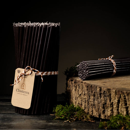 Closterra thin black beeswax taper candles, with a Closterra gift tag