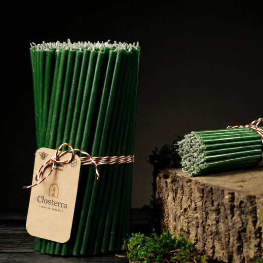 Closterra thin green beeswax taper candles, with a Closterra gift tag