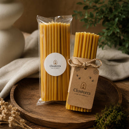 Closterra thin natural yellow beeswax taper candles, in Closterra packaging