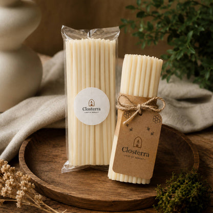 Closterra thin white beeswax taper candles, in Closterra packaging