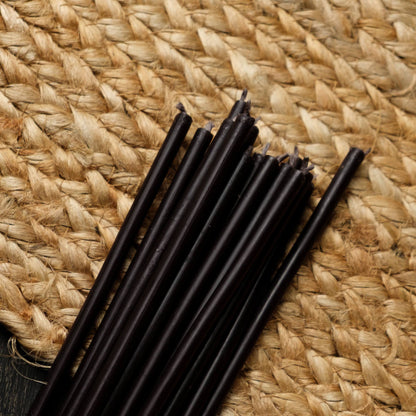 Closterra thin black beeswax taper candles, loose unlit tapers