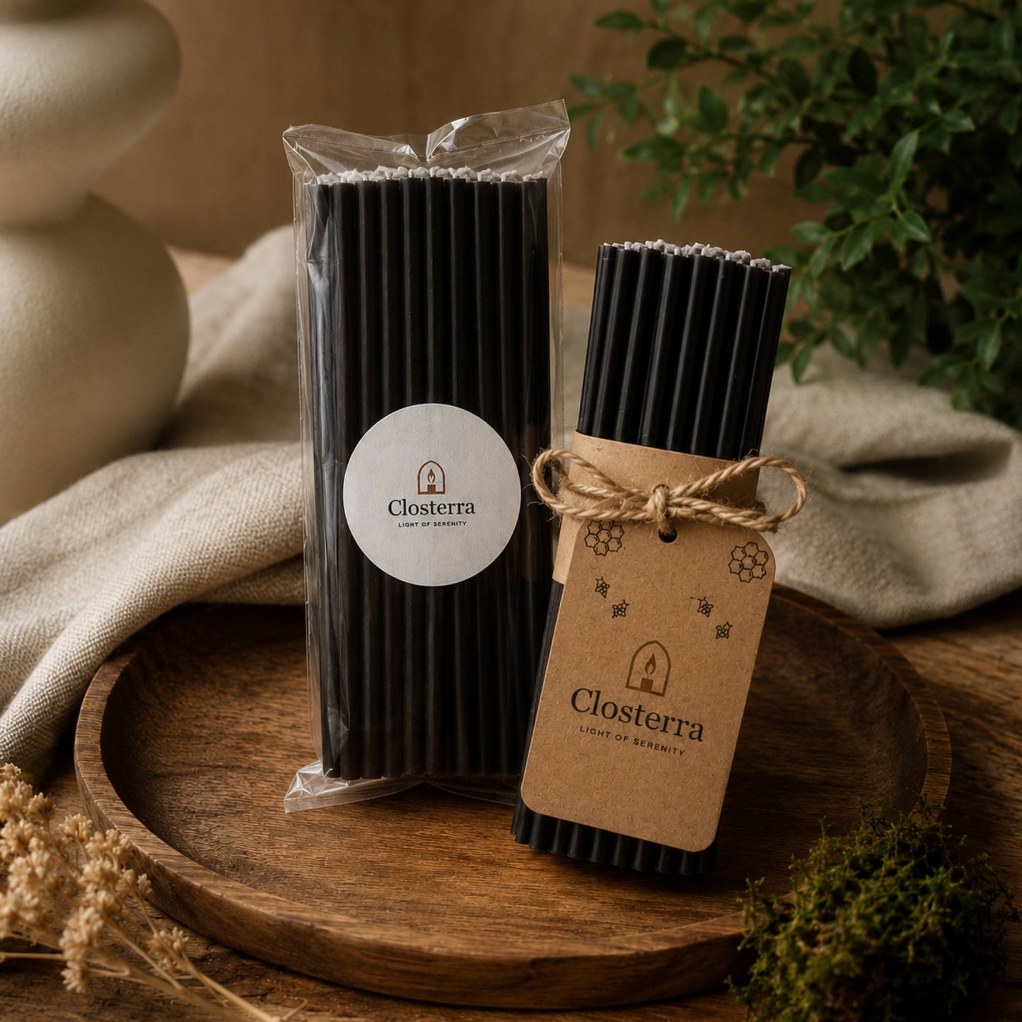 Closterra thin black beeswax taper candles, in Closterra packaging