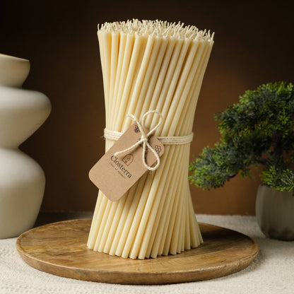 Closterra thin white beeswax taper candles, a bundle of tapers tied together