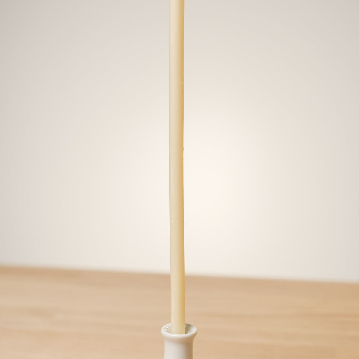 White beeswax taper candles 6.3″, single taper in a white holder