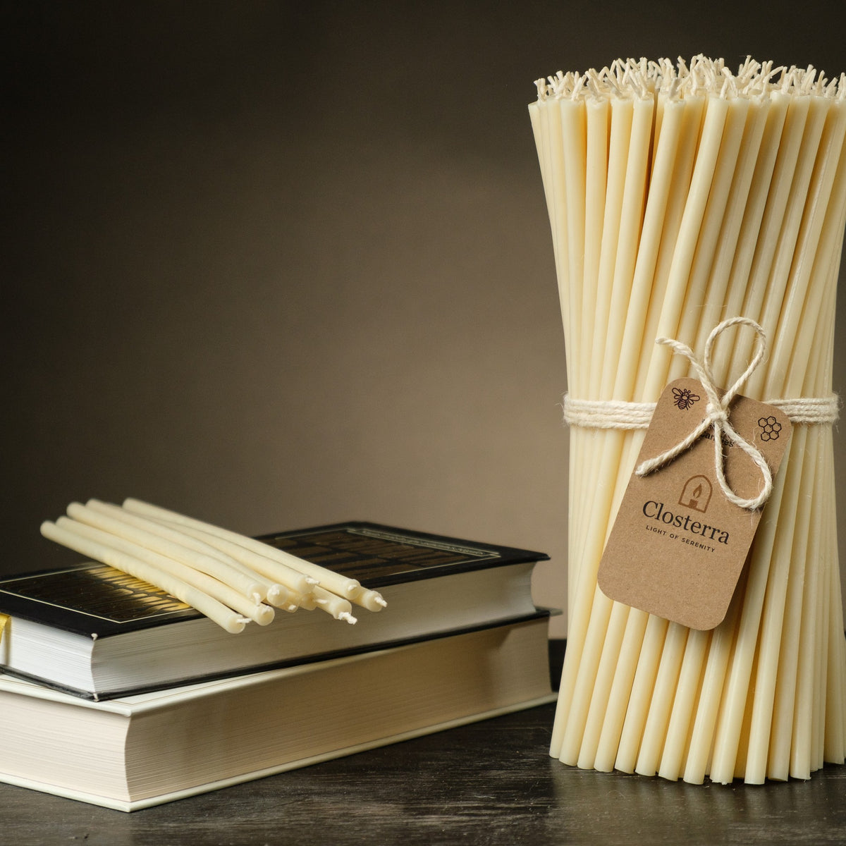White beeswax taper candles 6.5″, bundle with a Closterra tag beside books