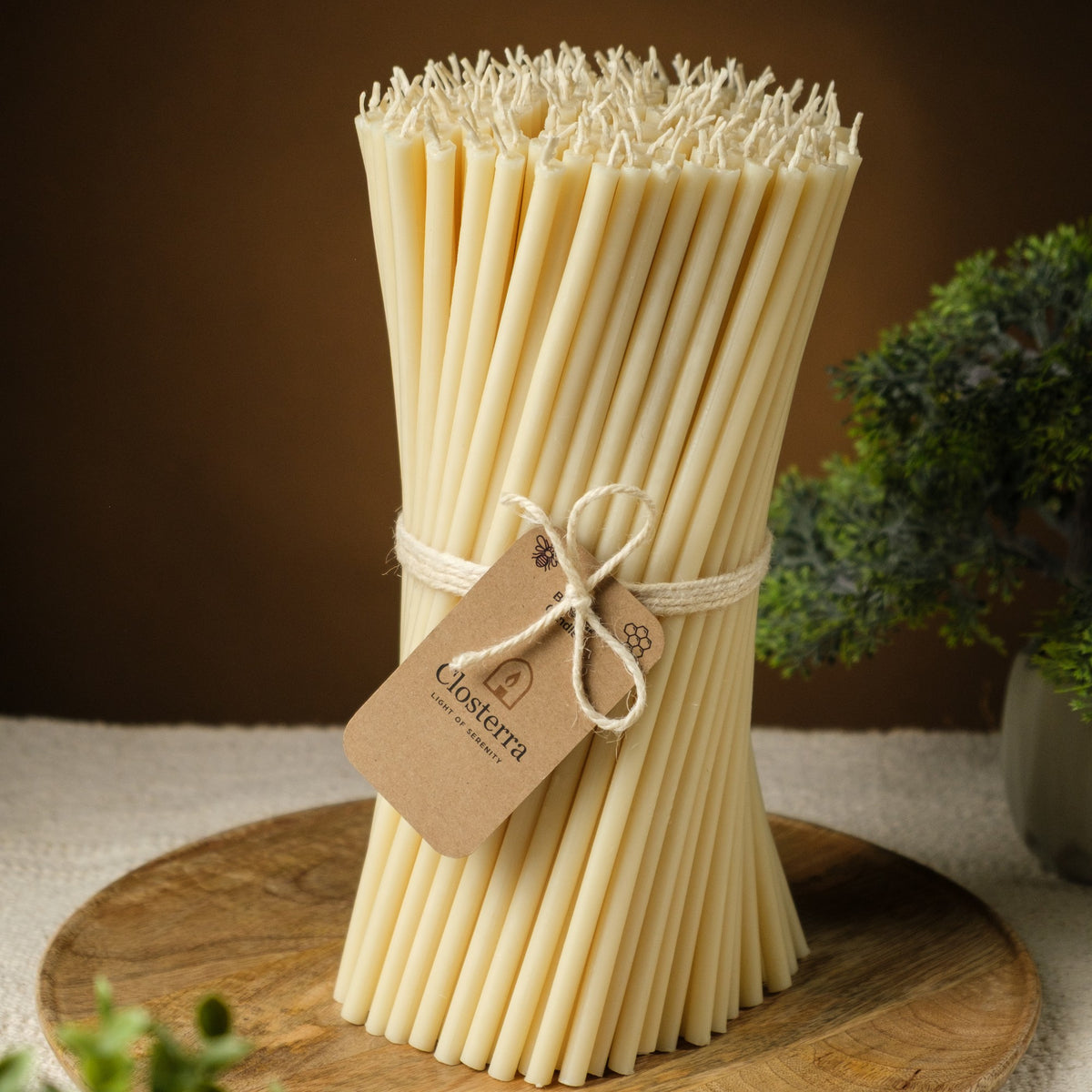 White beeswax taper candles 7.3″, bundle with a Closterra tag on a wooden tray