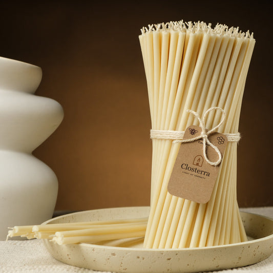 White beeswax taper candles 7.3″, bundle with a Closterra tag beside a white vase