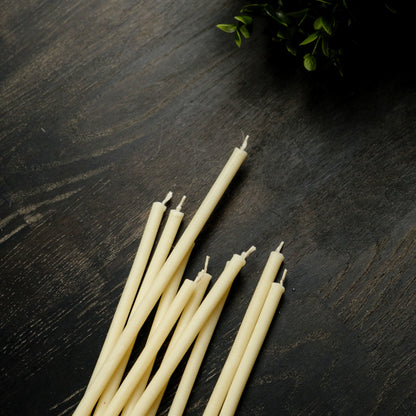 White beeswax taper candles 7.3″, loose tapers on dark wood