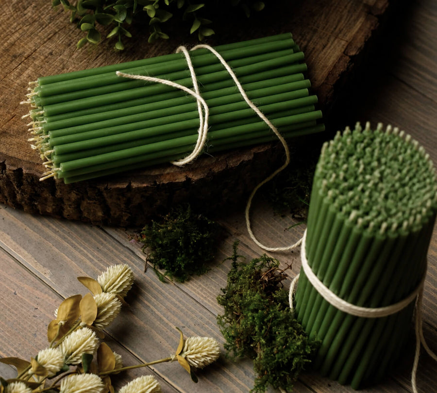 Green thin beeswax taper candles by Closterra