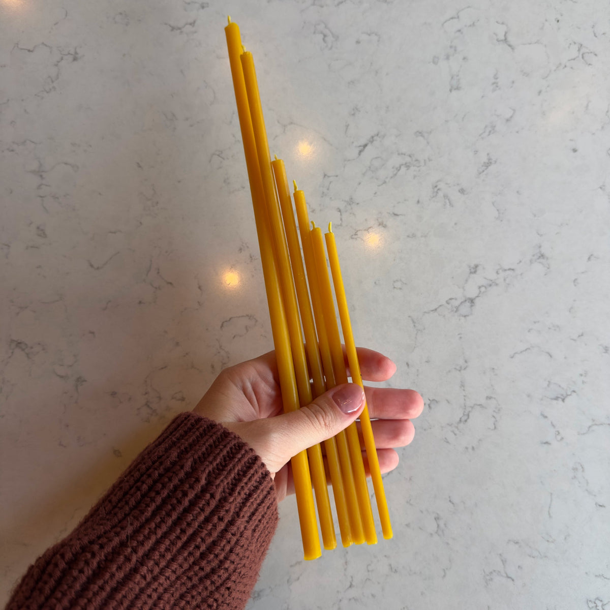 11.6 inch natural beeswax Hanukkah candles held in hand