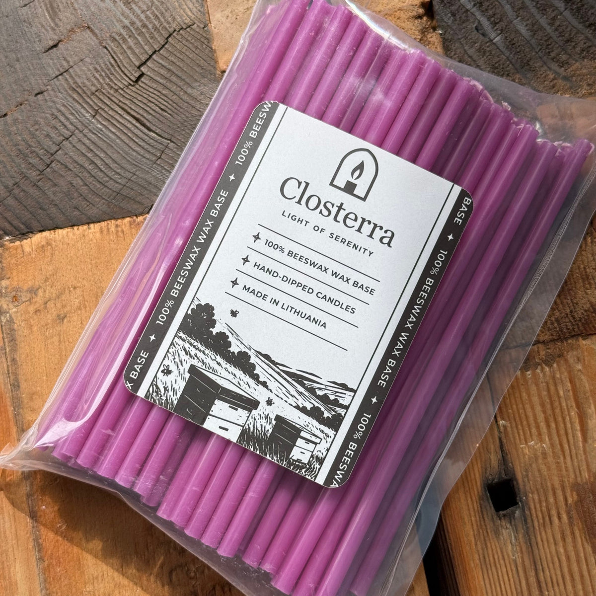 Purple beeswax taper candles 6.5″, in closterra packaging angled