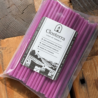 Purple beeswax taper candles 6.5″, in closterra packaging angled