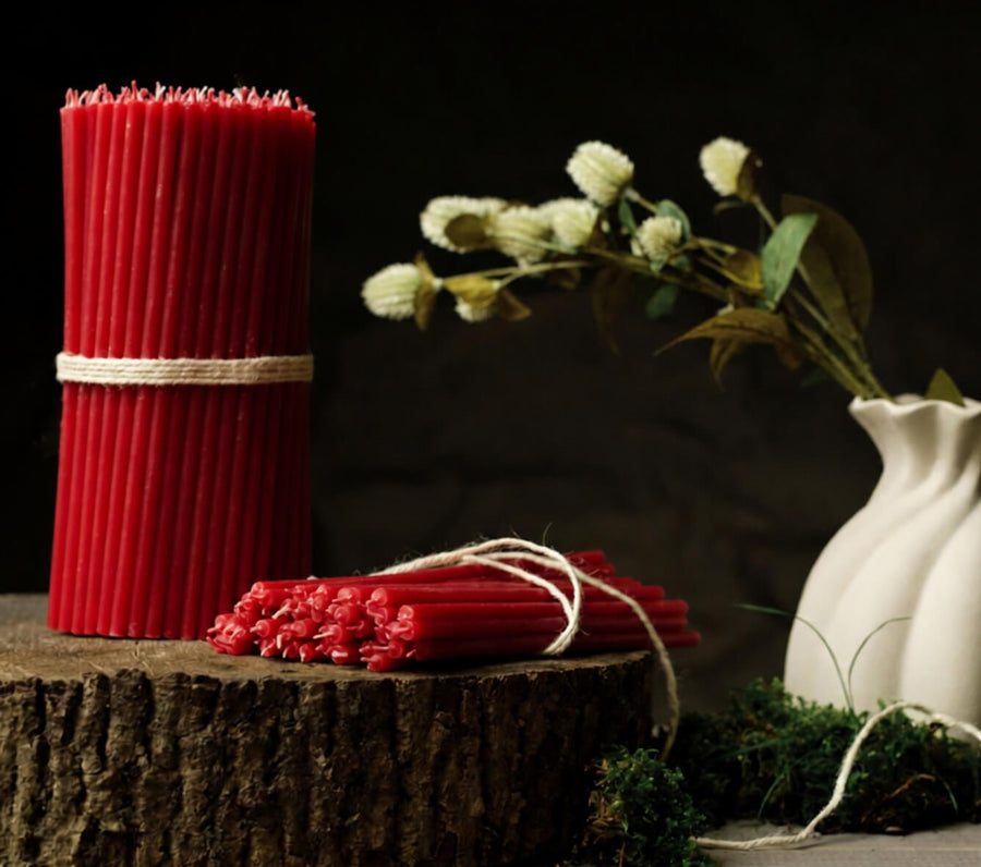 Red thin beeswax taper candles by Closterra