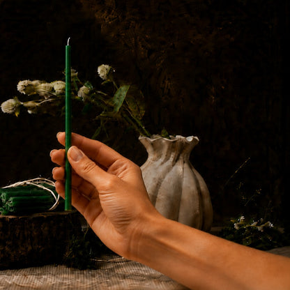 Green thin beeswax taper candle held in hand, 7.3 inch, Closterra