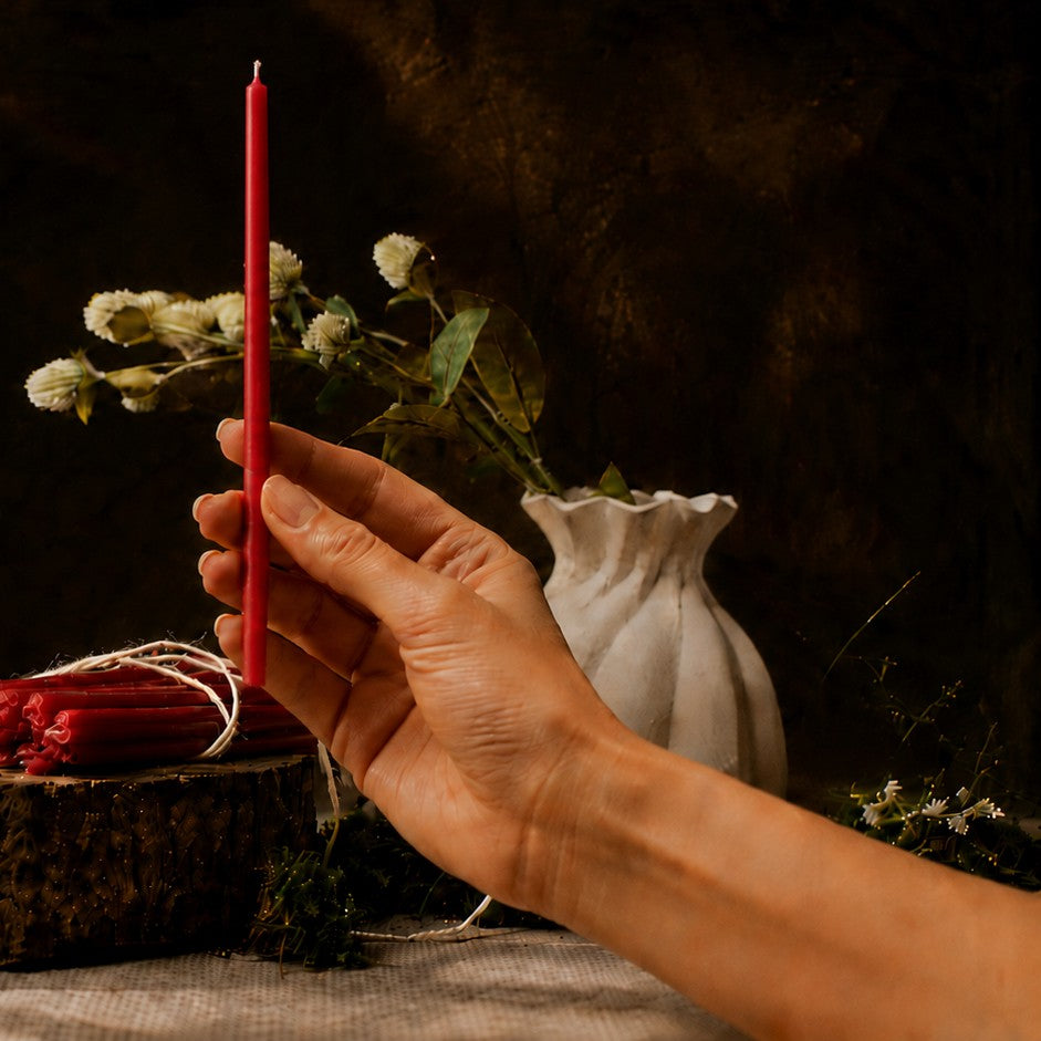 Red thin beeswax taper candle held in hand, 7.3 inch, Closterra
