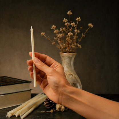 White thin beeswax taper candle held in hand, 6.5 inch, Closterra