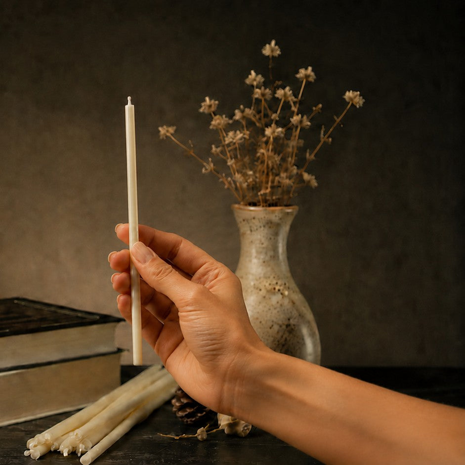 White thin beeswax taper candle held in hand, 7.3 inch, Closterra